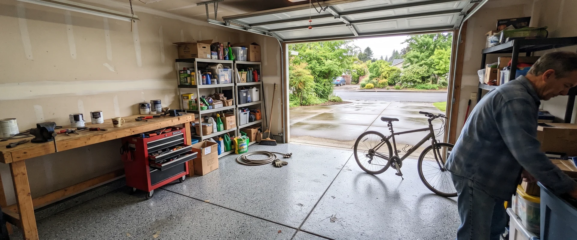 Finished flake epoxy garage floor in a Eugene home with the door open to daylight